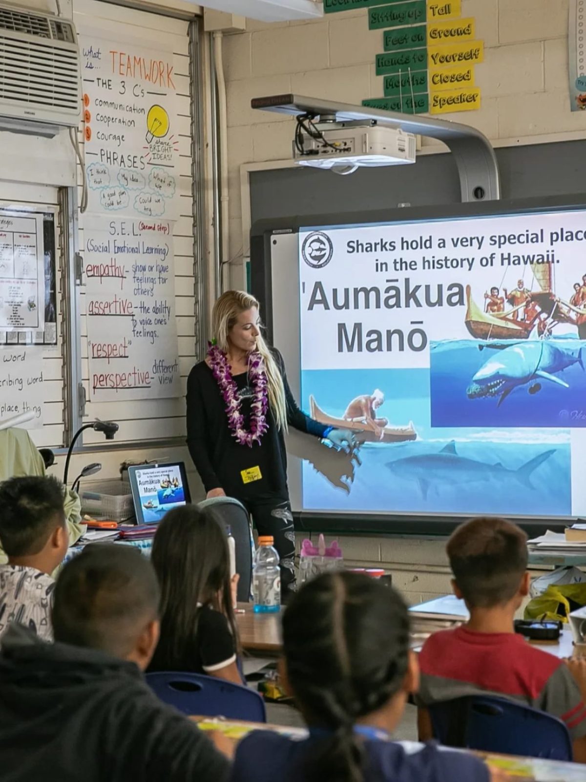 a group of people sitting in front of a store
