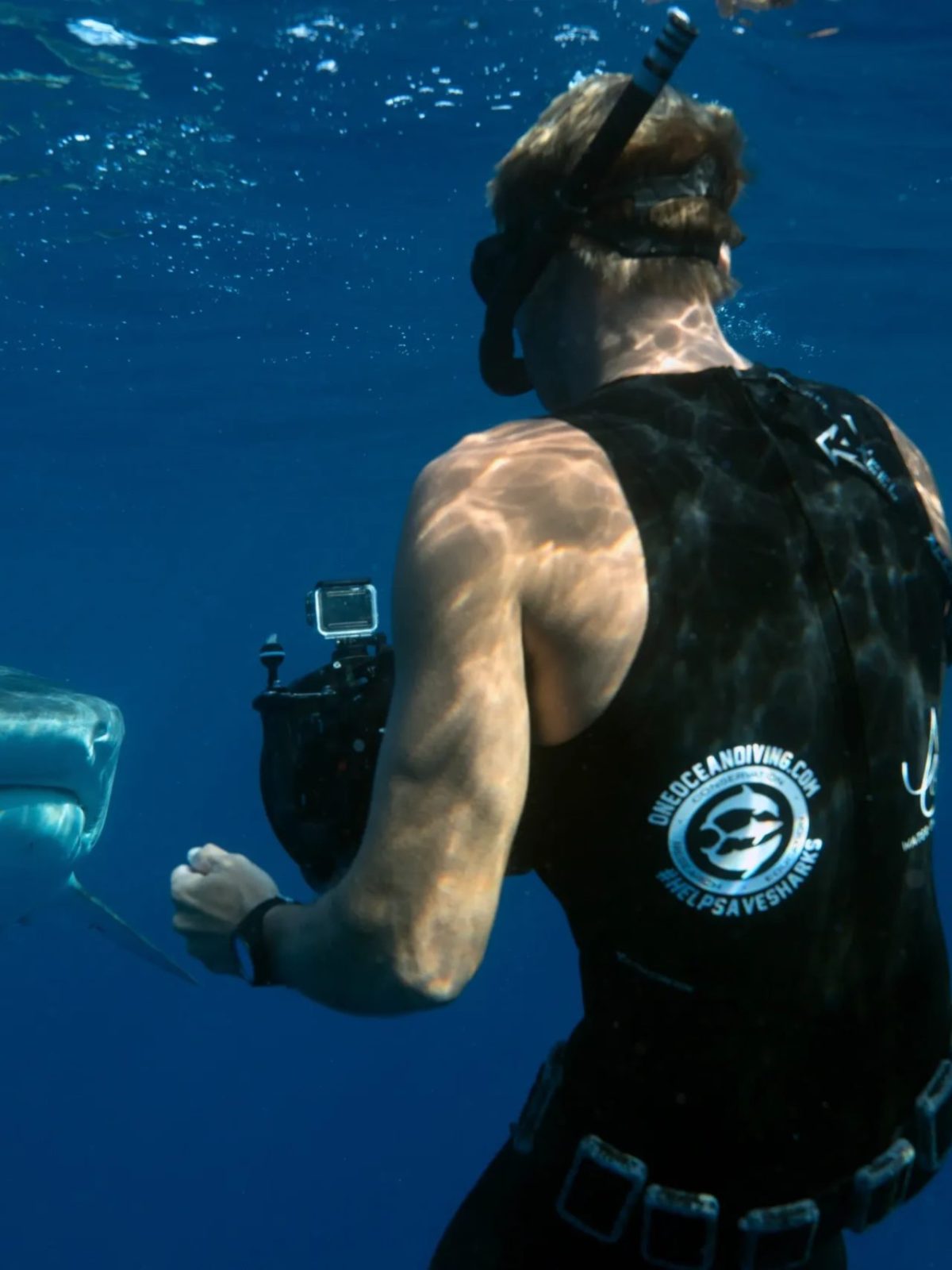 a man that is standing in the water